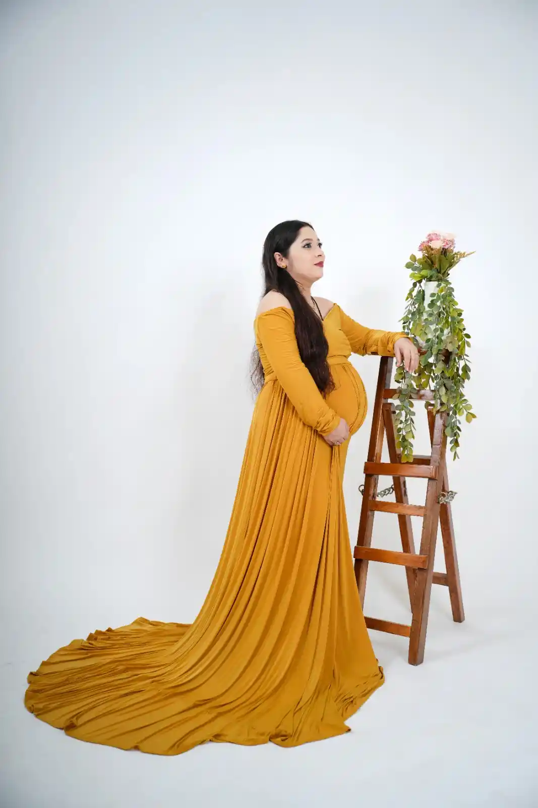 maternity shoot in yellow gown