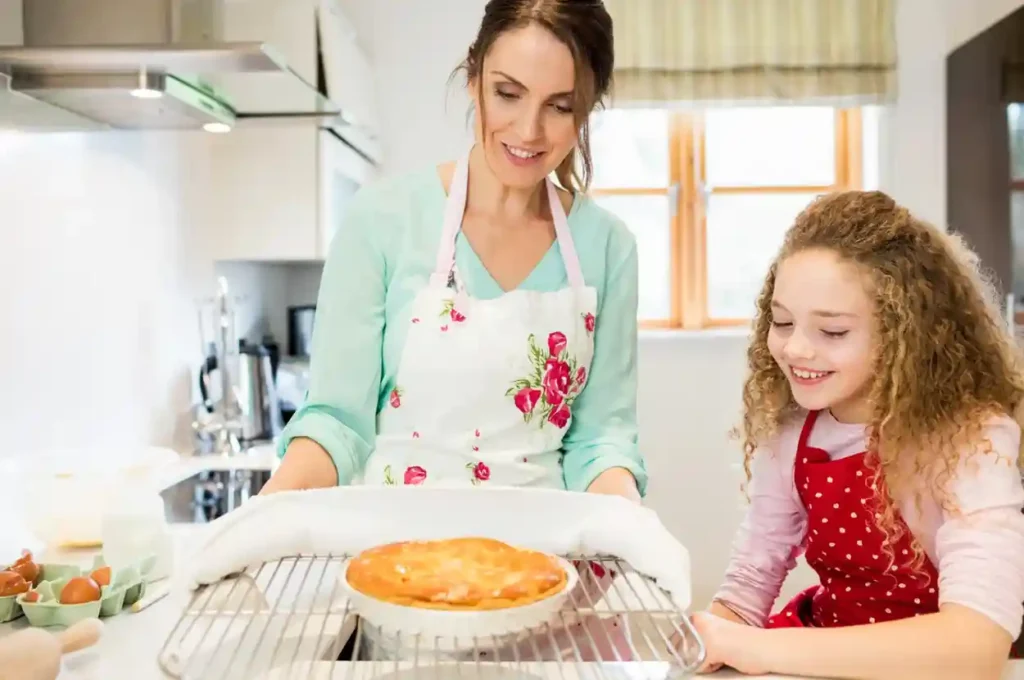 mother and daughter baking toghether