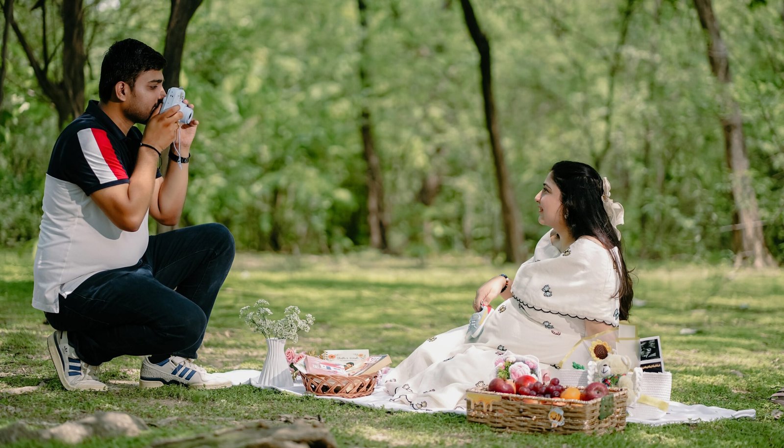 Maternity Photography in Lucknow by Chitrageek Studios, capturing an intimate and elegant maternity portrait with the expecting mother in a beautiful natural setting
