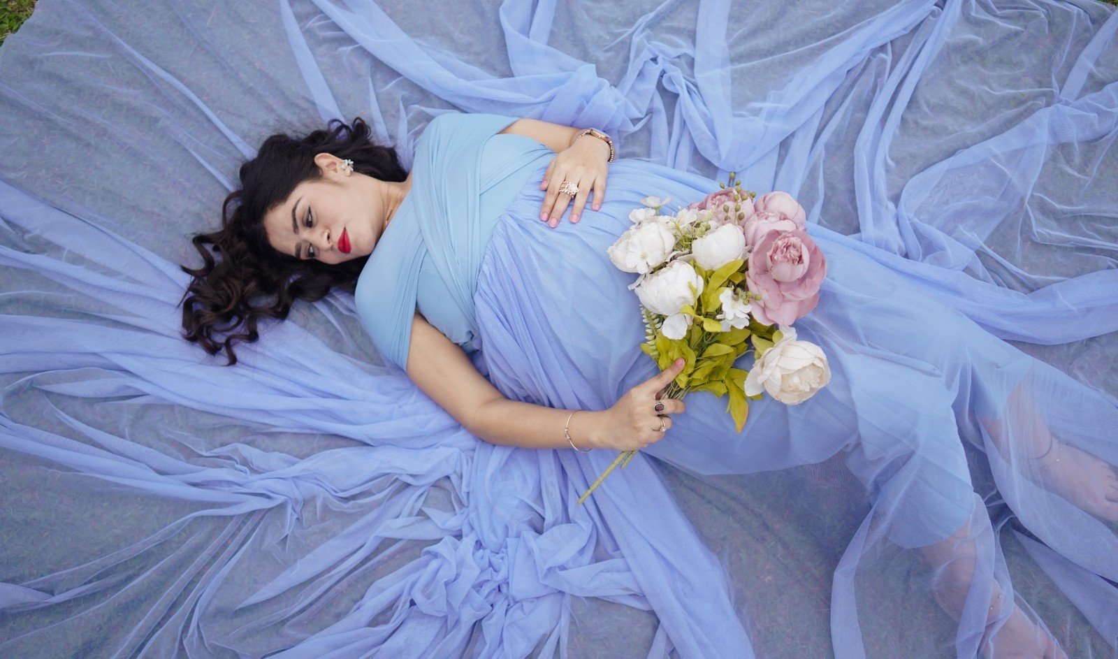 Maternity Photography in Guwahati by Chitrageek Studios, capturing an expecting mother and her partner sharing a warm and intimate moment during a maternity portrait session